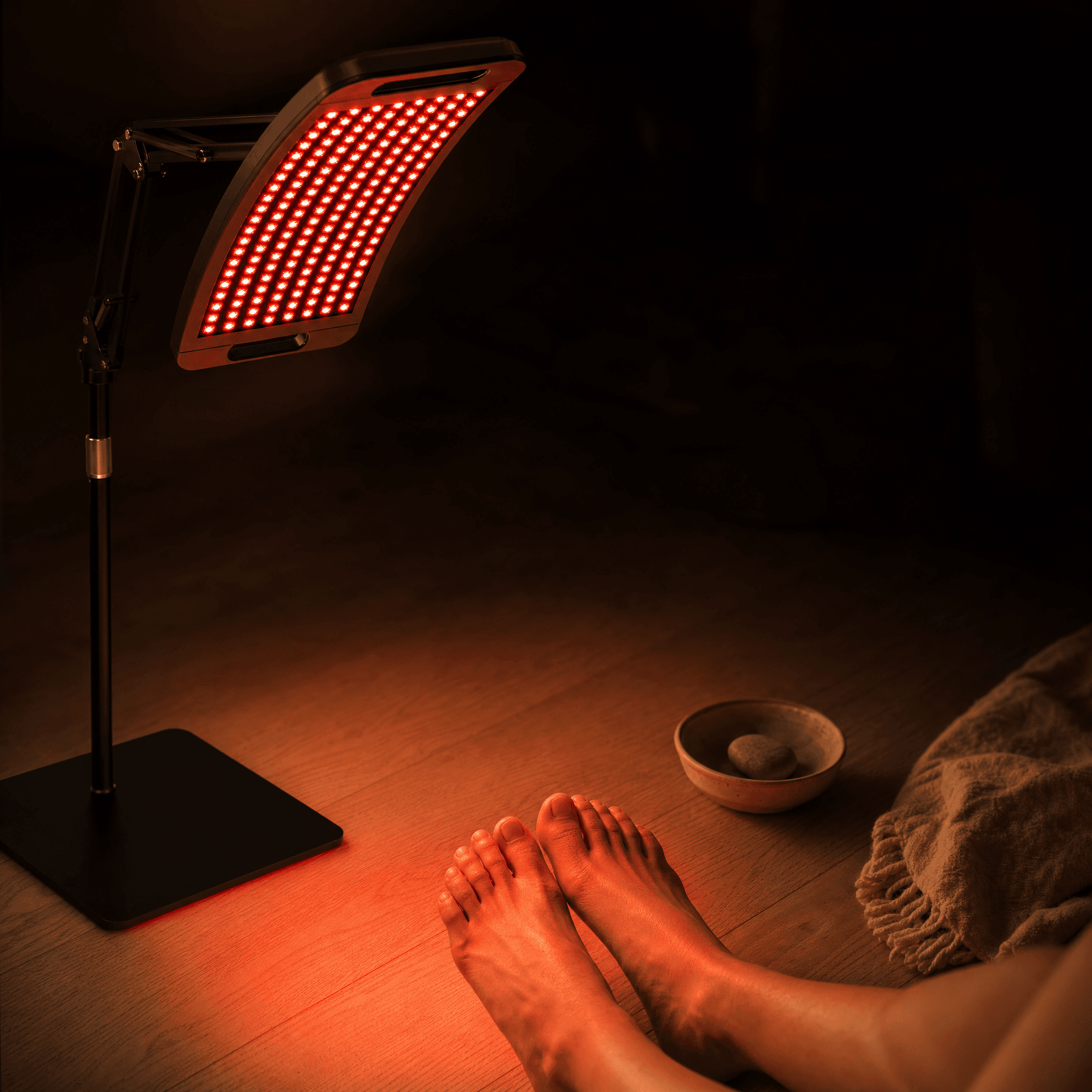 Halo aimed at a pair of resting bare feet in a calm dim room